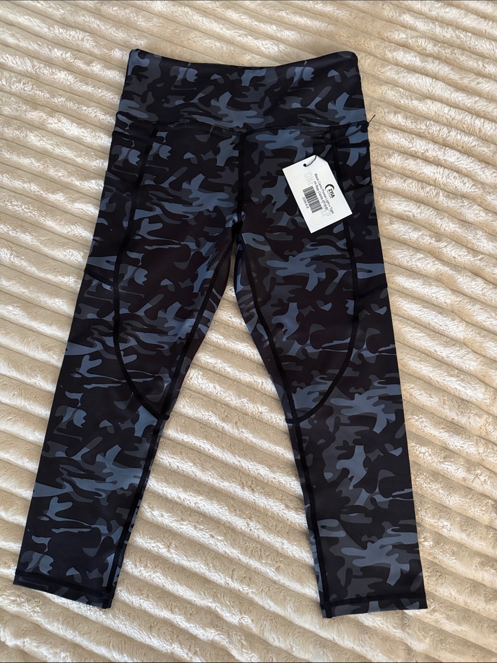 New with tags ZYIA Active Black Camo Pocket Light n Tight Hi-Rise Capris.